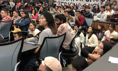 Students With a banner for Chow's resignation