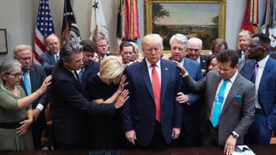 faith leaders pray over President Donald Trump
